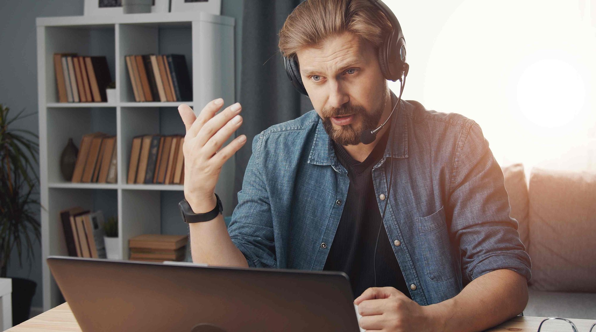 man on a conference call at home